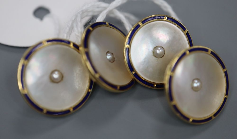 A pair of 18ct, mother of pearl seed pearl and blue enamel set disc cufflinks, diameter 14mm, gross 8.5 grams.